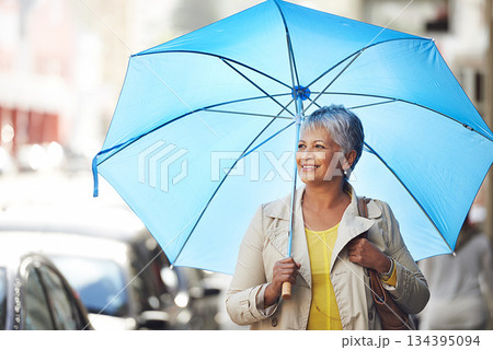 Walking, umbrella and senior happy woman on city commute, travel and smile on urban journey. Winter weather, happiness and female person looking at Mexico street view, commuting and walk on road Walking, umbrella and senior happy woman on city commute, travel and smile on urban journey. Winter weather, happiness and female person looking at Mexico street view, commuting and walk on road 134395094