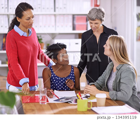 Women in meeting at fashion magazine, diversity and teamwork in conference room with collaboration. Planning, creative team of female employees working together and brainstorming editorial ideas Women in meeting at fashion magazine, diversity and teamwork in conference room with collaboration. Planning, creative team of female employees working together and brainstorming editorial ideas 134395119