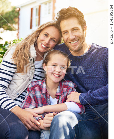 Backyard hug, family portrait and outdoor parents, child and faces of people bonding, support and quality time together. Love, happy childhood and Canada mother, dad and kid enjoy spring sunshine Backyard hug, family portrait and outdoor parents, child and faces of people bonding, support and quality time together. Love, happy childhood and Canada mother, dad and kid enjoy spring sunshine 134395364