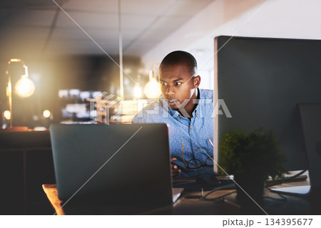 Business stress, man working and computer at night with office typing and project web research. African male worker, technology and coding for website management for company with tech and anxiety 134395677