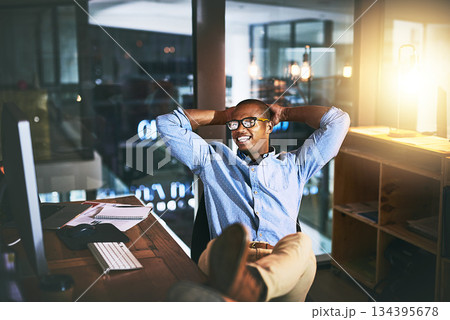 Night, business and man relax, employee and creative with startup success, company development and computer. Male person, entrepreneur or consultant working late, chilling or technology in the office Night, business and man relax, employee and creative with startup success, company development and computer. Male person, entrepreneur or consultant working late, chilling or technology in the office 134395678