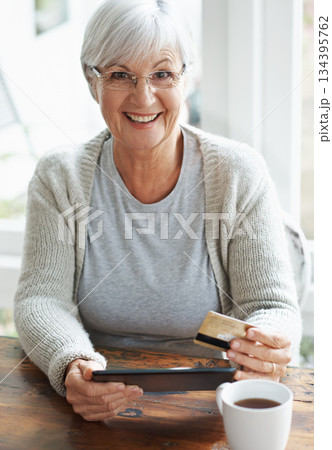Happy senior woman, tablet and credit card for online shopping, payment or banking on table at home. Portrait of excited elderly female shopper on technology for ecommerce, purchase or bank app Happy senior woman, tablet and credit card for online shopping, payment or banking on table at home. Portrait of excited elderly female shopper on technology for ecommerce, purchase or bank app 134395762
