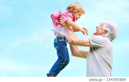 Happy, lifting and fun with grandfather and grandson for bonding, affectionate and free time space. Happiness, smile and playing with old man and young boy for family, generations and blue sky mockup Happy, lifting and fun with grandfather and grandson for bonding, affectionate and free time space. Happiness, smile and playing with old man and young boy for family, generations and blue sky mockup 134395809