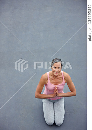 Mockup, yoga and portrait of old woman with praying hands on floor for meditation, healing and balance from above. Mindfulness, prayer pose and space for elderly lady meditating for zen or wellness Mockup, yoga and portrait of old woman with praying hands on floor for meditation, healing and balance from above. Mindfulness, prayer pose and space for elderly lady meditating for zen or wellness 134395840