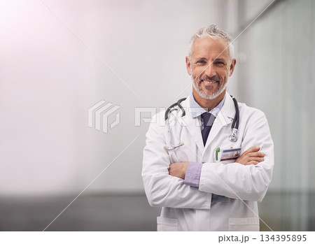 Doctor, healthcare and happy portrait of a man in a hospital with mockup space for health insurance. Professional male medical worker with a stethoscope for a consultation, healing and wellness Doctor, healthcare and happy portrait of a man in a hospital with mockup space for health insurance. Professional male medical worker with a stethoscope for a consultation, healing and wellness 134395895