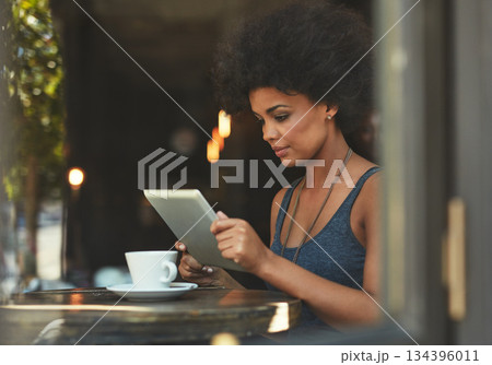 Tablet reading, focus and cafe woman, customer or freelance worker doing online project, research or report article. Review, analysis and person check restaurant, coffee shop or store sales insight Tablet reading, focus and cafe woman, customer or freelance worker doing online project, research or report article. Review, analysis and person check restaurant, coffee shop or store sales insight 134396011