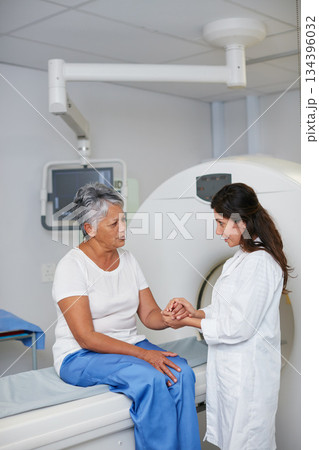 Doctor, mri and woman holding hands of patient in hospital before scanning in machine. Ct scan, comfort or medical professional with senior female person in radiology test for healthcare consultation 134396032