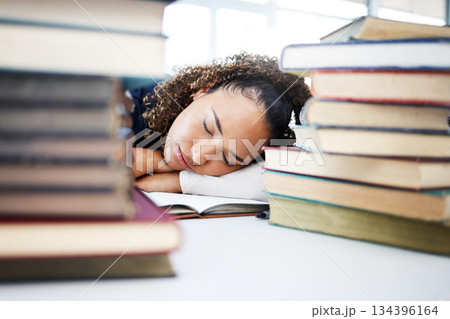 Woman, sleeping or medical student in stress, hospital research burnout or learning books fatigue. Tired, exhausted or asleep healthcare nurse in notebook studying or scholarship medicine internship 134396164