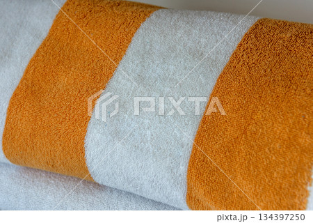 Orange and White Striped Towel on White Background Orange and White Striped Towel on White Background 134397250