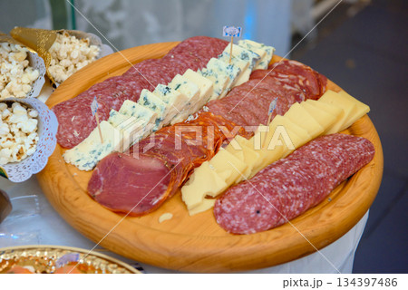 Catering gourmet tapas platter with mix jamon serrano blue cheese and prosciutto 134397486