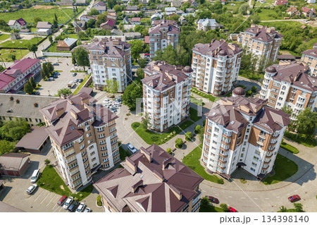 Top view of apartment or office tall buildings, parked cars, urban city landscape. Drone aerial photography. 134398140