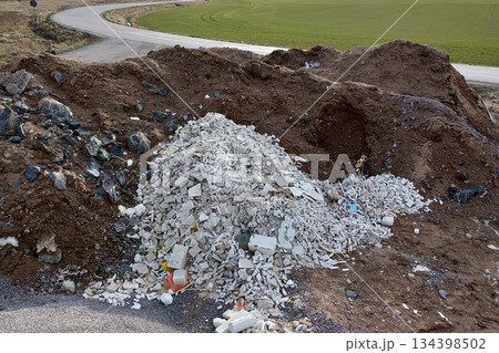 Pile of broken garbage plaster at construction site. 134398502