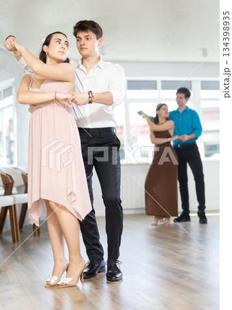 Couple young woman and man dancing waltz Couple young woman and man dancing waltz 134398935