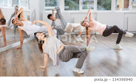 Young girl practicing breakdance in training hall 134398940
