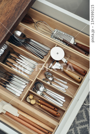 Bamboo organizer with cutlery in kitchen drawer Bamboo organizer with cutlery in kitchen drawer 134399115