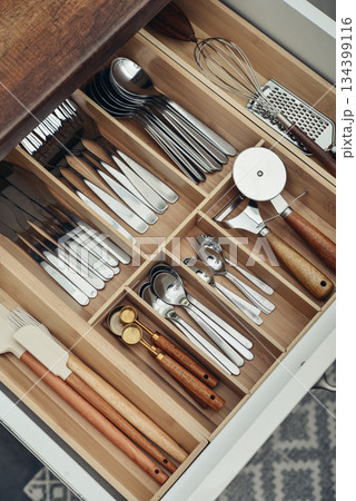 Bamboo organizer with cutlery in kitchen drawer Bamboo organizer with cutlery in kitchen drawer 134399116