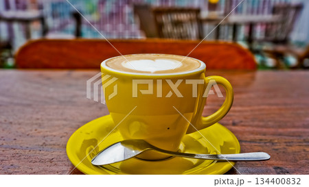close up photo of a cup of coffee on a brown table close up photo of a cup of coffee on a brown table 134400832