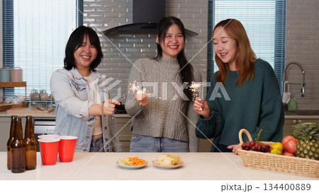 Group of friends enjoying a festive party moment 134400889