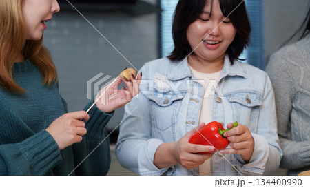 Cooking Party: Friends Preparing Healthy Meal Together in Modern Kitchen Cooking Party: Friends Preparing Healthy Meal Together in Modern Kitchen 134400990