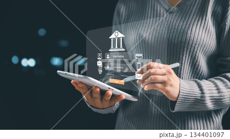 Person using tablet with virtual online banking login interface, representing secure financial access, digital banking technology, payment systems, data protection, modern financial authentication. Person using tablet with virtual online banking login interface, representing secure financial access, digital banking technology, payment systems, data protection, modern financial authentication. 134401097