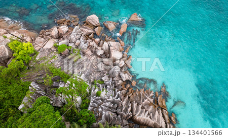Island striking granite boulders, lush greenery, and bright turquoise waters. St Pierre Island. Seychelles. 134401566