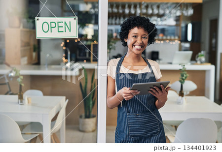 Happy woman, tablet and portrait of waitress with open sign for communication, social media or online order at cafe. Female person or barista in small business with smile on technology at coffee shop Happy woman, tablet and portrait of waitress with open sign for communication, social media or online order at cafe. Female person or barista in small business with smile on technology at coffee shop 134401923