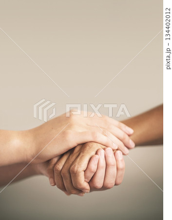 Help, support and love with people holding hands in comfort, care or to console each other. Trust, empathy or healing with friends praying together during depression, anxiety or the pain of loss 134402012