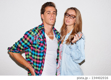 Smoking, tobacco and portrait of hipster couple with white wall background, gen z fashion and university culture in youth. Cigarette, woman with glasses and man at college, cool people with smoke. Smoking, tobacco and portrait of hipster couple with white wall background, gen z fashion and university culture in youth. Cigarette, woman with glasses and man at college, cool people with smoke. 134402016