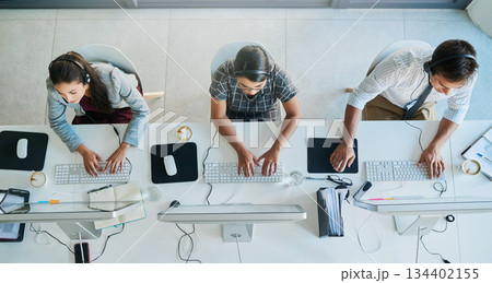 Call center, computer and top view with business people in office for communication, customer service and contact us. Help desk, online and team of employee in agency for consulting and advisory 134402155