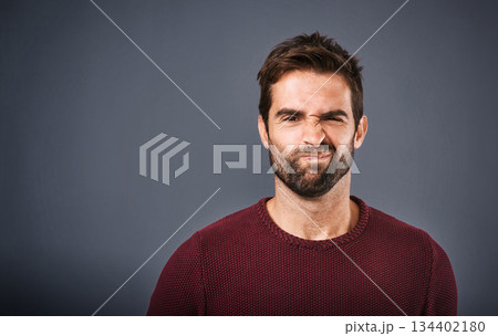 Doubt, confused and portrait of man in studio with unsure, uncertain and thoughtful on gray background. Thinking, mockup space and face of male person skeptical for decision, choice and question 134402180