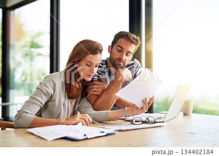 Finance, documents and couple planning budget for tax, bills and savings on laptop with banking, online payment and investment. People, paperwork and conversation on household financial strategy Finance, documents and couple planning budget for tax, bills and savings on laptop with banking, online payment and investment. People, paperwork and conversation on household financial strategy 134402184