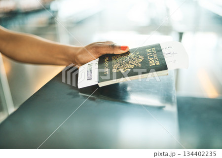 Hand, passport and airport service counter closeup or boarding flight, support and travel desk administration. Travelling tourist, checkin and person with id book, ticket and journey documents Hand, passport and airport service counter closeup or boarding flight, support and travel desk administration. Travelling tourist, checkin and person with id book, ticket and journey documents 134402235