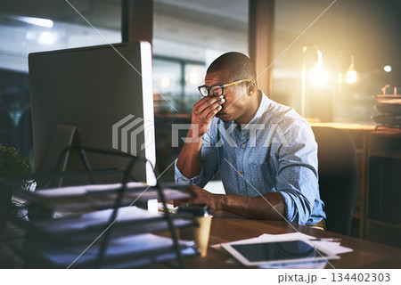 Black man at office, night and headache with stress and vision problem, computer glitch and burnout from overtime. Male in business with migraine, brain fog and working late, frustrated with 404 Black man at office, night and headache with stress and vision problem, computer glitch and burnout from overtime. Male in business with migraine, brain fog and working late, frustrated with 404 134402303