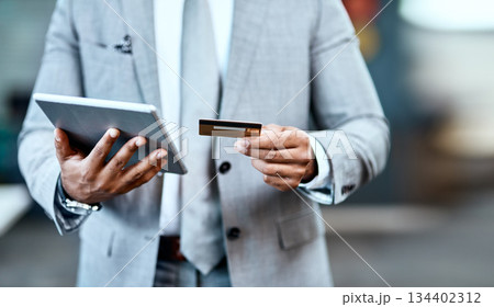 Man hands, tablet and credit card for online shopping, ecommerce and fintech application, loan or finance. Business person typing, website banking and digital tech payment or easy, office transaction 134402312