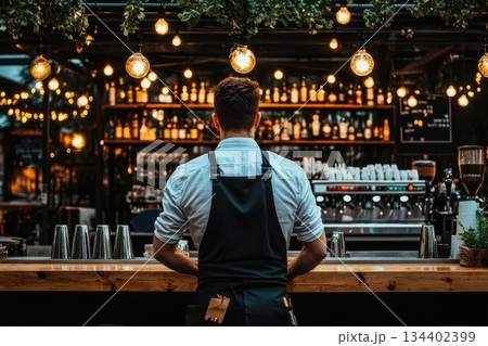 Cozy Bar Scene with Bartender Preparing Drinks in a Stylish Ambiance at Night 134402399