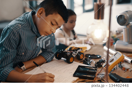 Learning, writing in notebook and child with robotics homework, homeschool and science for tech project. Taking notes, car robot and boy kid with knowledge, education and studying in house alone. Learning, writing in notebook and child with robotics homework, homeschool and science for tech project. Taking notes, car robot and boy kid with knowledge, education and studying in house alone. 134402448