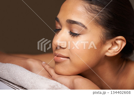 Woman, eyes closed or massage in hotel to relax for zen resting or wellness physical therapy in luxury spa. Face of girl sleeping in salon resort for body healing treatment or natural holistic detox 134402608