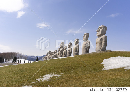 Moai, big stone statue in winter with snow on ground at hill of Buddha in Sapporo, Makomanai takino 134402779