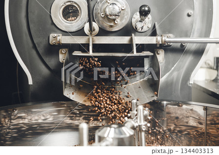 Roasted Coffee Flowing out From Roaster and Mixing Roasted Coffee Flowing out From Roaster and Mixing 134403313