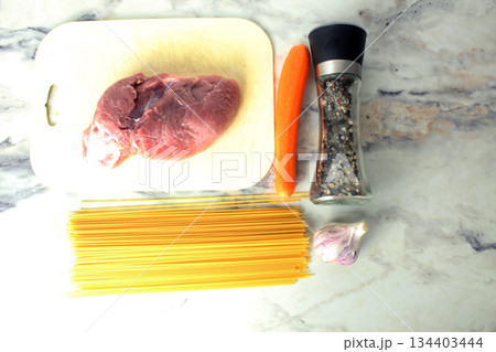 Layout of products cooking pasta with minced meat view from above. Layout of products cooking pasta with minced meat view from above. 134403444