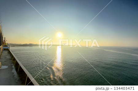 Experience the Tranquil Sunrise Over Serene Waters and bask in the beauty of natures calm Experience the Tranquil Sunrise Over Serene Waters and bask in the beauty of natures calm 134403471