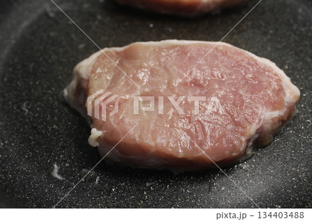 Piece of raw pork beef close-up view from above. 134403488