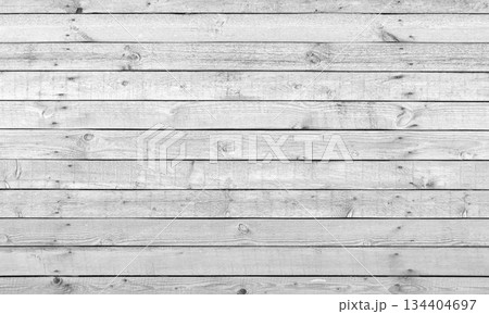 A close-up of a rustic wooden white plank wall showcasing grain patterns A close-up of a rustic wooden white plank wall showcasing grain patterns 134404697