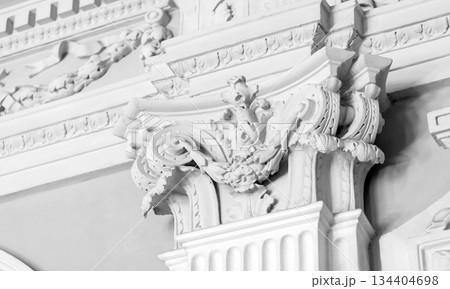 Intricately designed baroque ornamentation carving on a white wall Intricately designed baroque ornamentation carving on a white wall 134404698