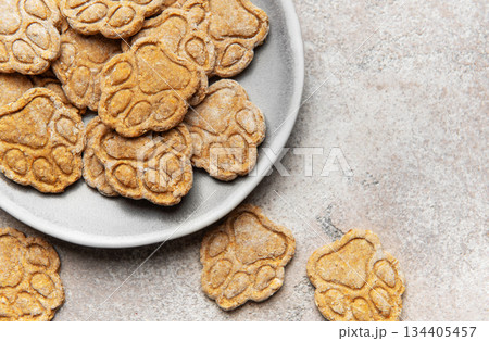 Homemade paw print dog treats on a plate 134405457