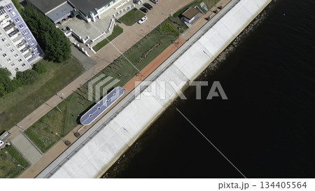 Embankment with solar panels and outdoor gym equipment by the river. Clip Embankment with solar panels and outdoor gym equipment by the river. Clip 134405564