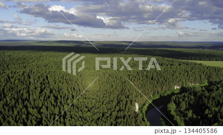 Clouds passing over green forest and river 134405586