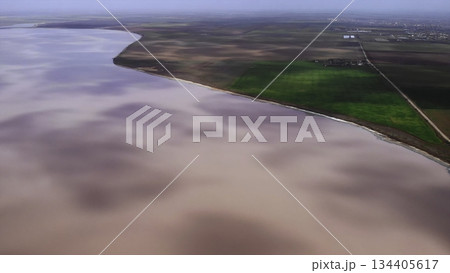 Aerial view of pink salt lake shoreline. Media Aerial view of pink salt lake shoreline. Media 134405617