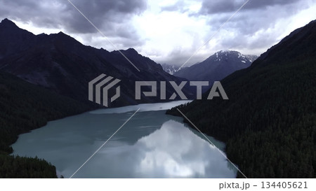 Kucherla lake reflecting clouds and mountains in altai republic. Media Kucherla lake reflecting clouds and mountains in altai republic. Media 134405621