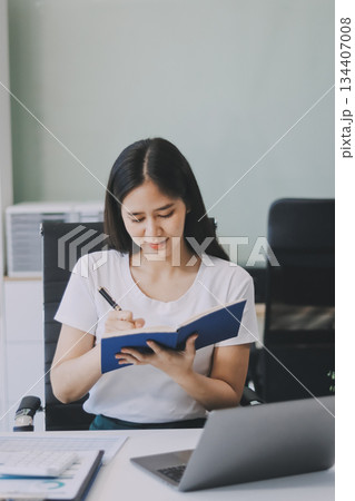 young woman reading a book 134407008